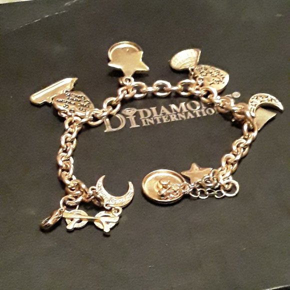 Unlisted Jewelry - CHARM BRACELET GOLD TONE WITH CRUISE SHIP EMBLEMS,
